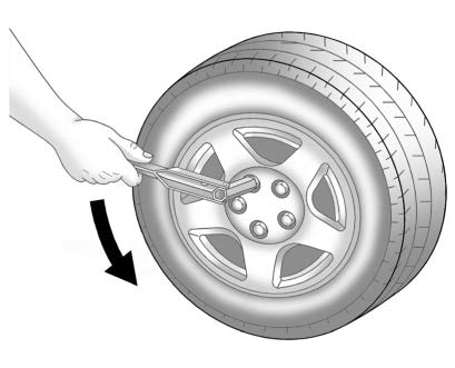 Removing the Flat Tire and Installing the Spare Tire