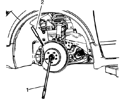 Fig. 5: Inserting Drift Or Punch In Brake Rotor Cooling Vanes