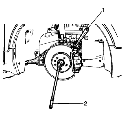 Fig. 19: Inserting Drift Or Punch In Brake Rotor Cooling Vanes