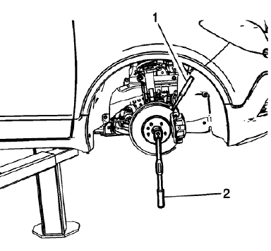 Fig. 27: Inserting Drift Or Punch In Brake Rotor Cooling Vanes